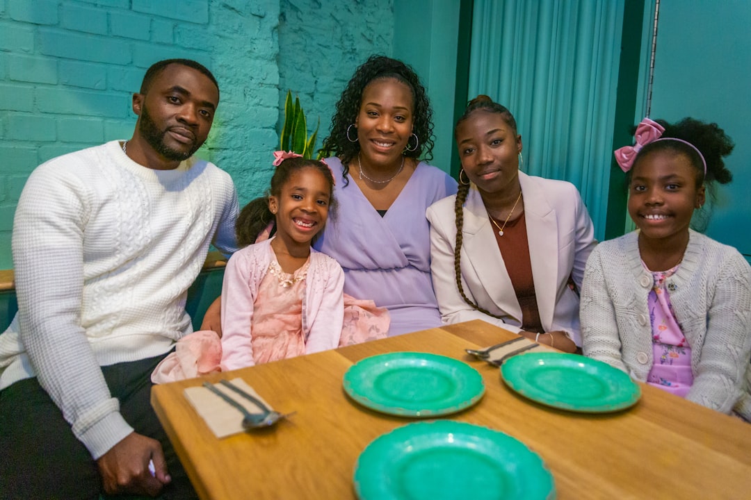 Family gathered around a table for Thanksgiving with children