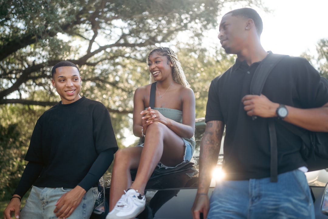 Friends smiling and enjoying a sunny afternoon outdoors